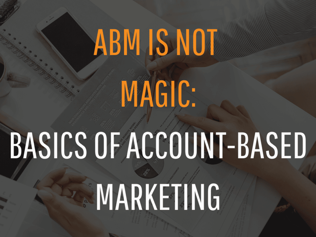 A background image of people reviewing documents with a laptop and a smartphone on the table is overlaid with the text "ABM is not magic: Marketing Basics of Account-Based Marketing" in large, bold letters.