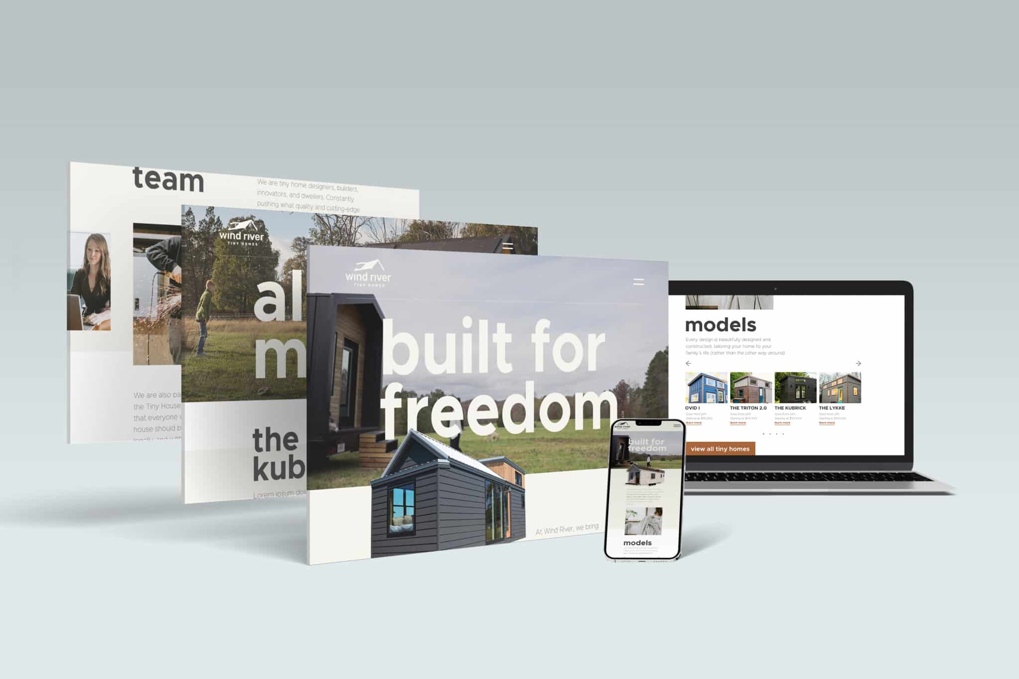 A laptop, smartphone, and three website pages are shown displaying different elements of a website for "Wind River." The pages include text such as "built for freedom," "team," and "models," along with images of Tiny Homes. The overall theme is modern and minimalist, showcasing Wind River as a Big Brand in innovative living spaces.