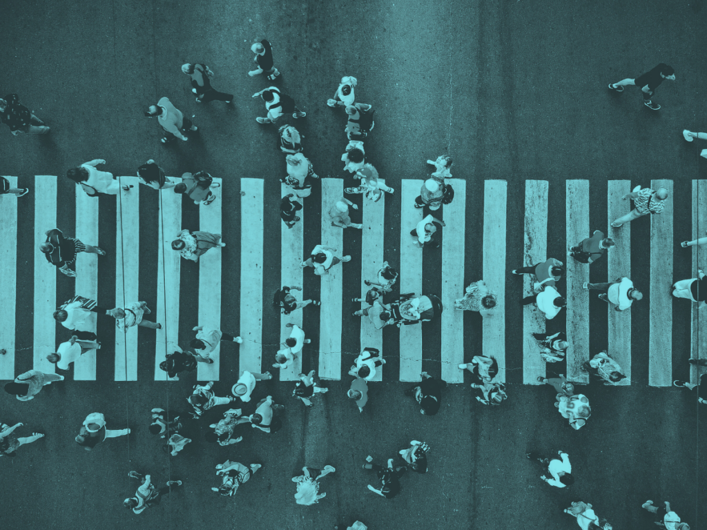 People crossing a busy cross walk