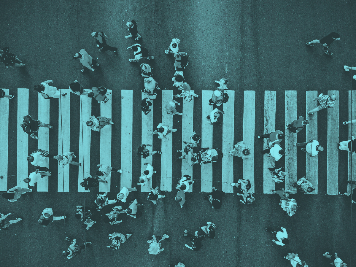 People crossing a busy cross walk