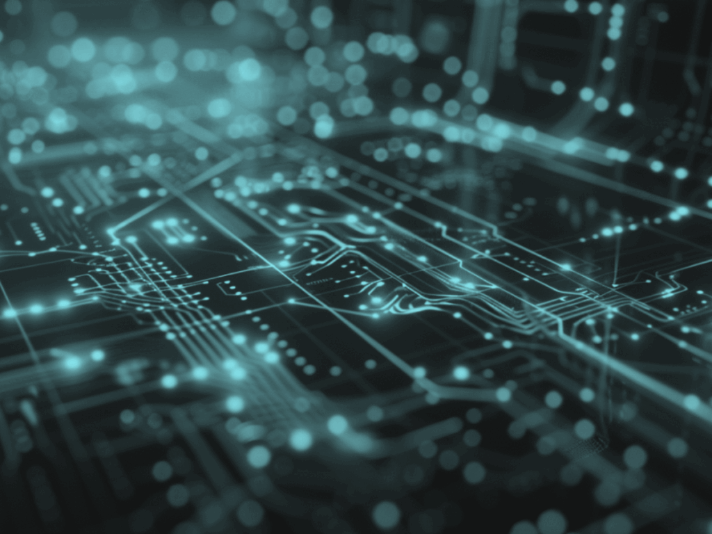 Close-up of a glowing digital circuit board with blue and orange data pathways, symbolizing AI integration and advanced technology systems.