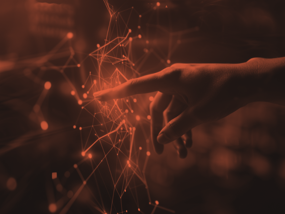 Hand interacting with glowing AI data interface, symbolizing human-AI collaboration and digital transformation.