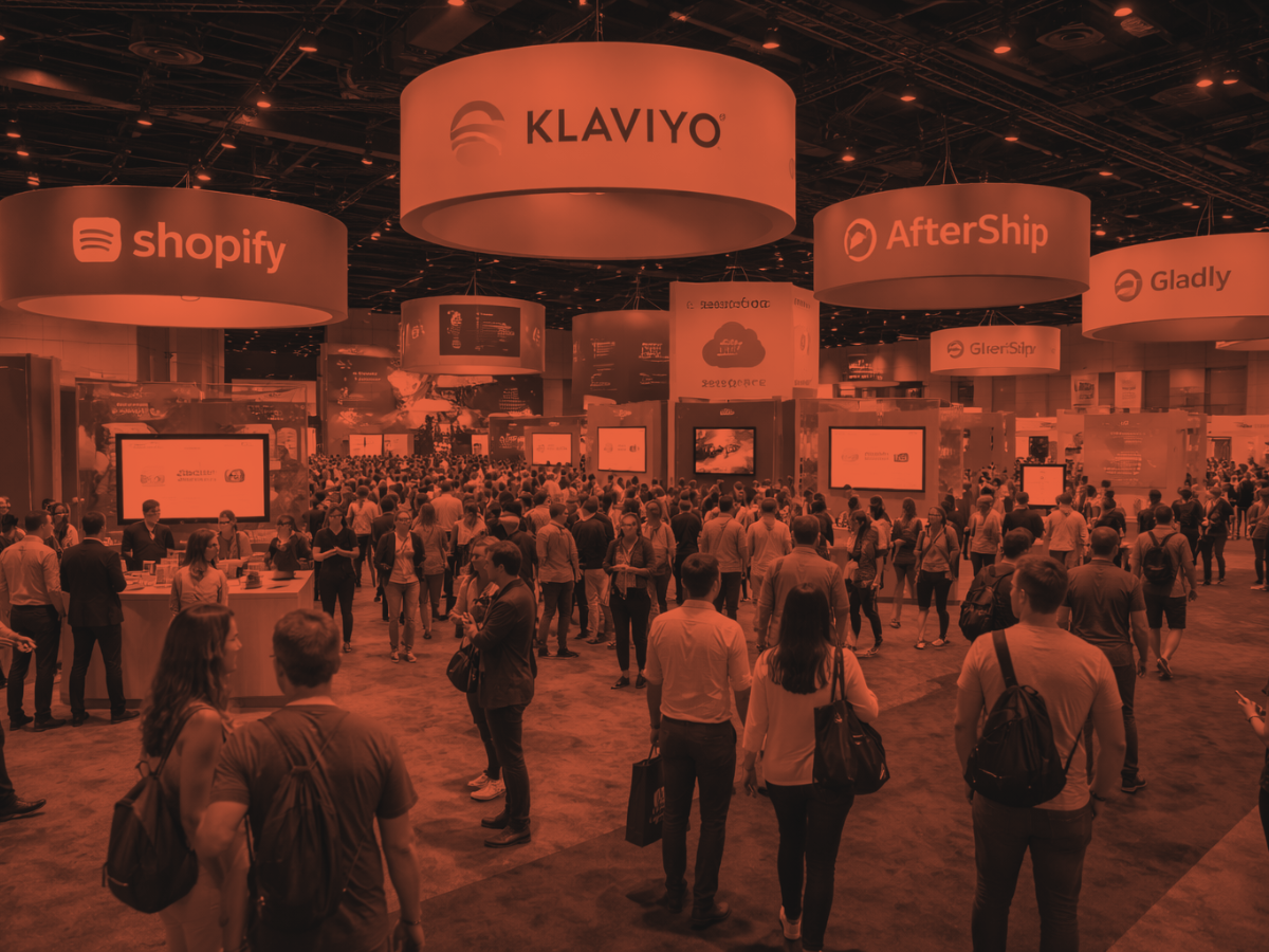 Crowded ecommerce and retail technology conference floor with vendor booths and attendees networking at a convention.